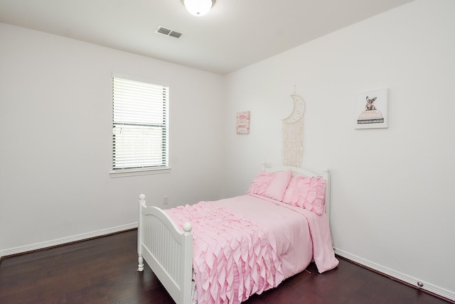 4615 Montcliff Bend Ln, Sugar Land, TX 77479 - bedroom with wood finished floors and baseboards