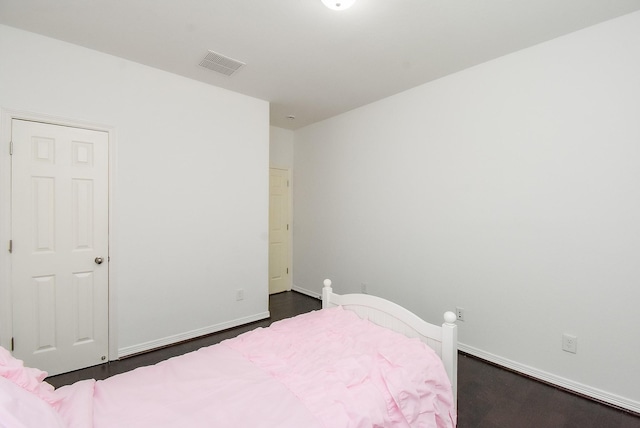 4615 Montcliff Bend Ln, Sugar Land, TX 77479 - bedroom with dark wood finished floors