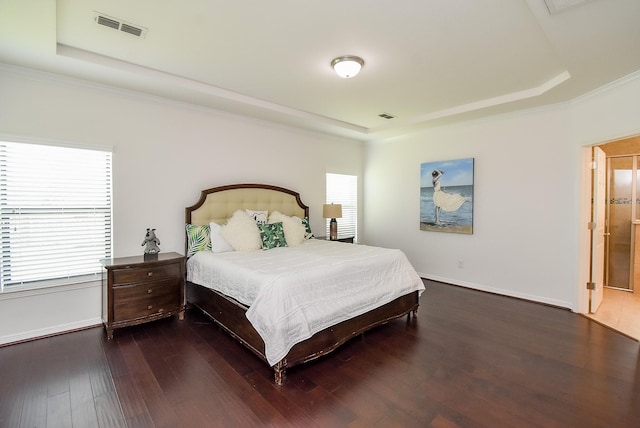 4615 Montcliff Bend Ln, Sugar Land, TX 77479 - bedroom featuring a tray ceiling, wood finished floors, and crown molding