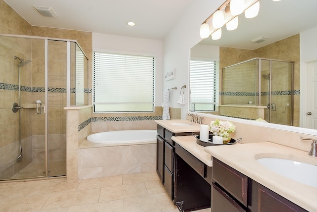 4615 Montcliff Bend Ln, Sugar Land, TX 77479 - full bathroom featuring vanity, a shower stall, a garden tub, tile patterned floors, and recessed lighting