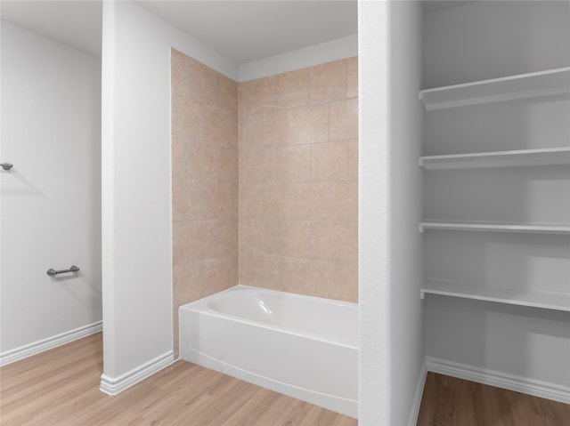 312 N Orange St, Sweeny, TX 77480 - bathroom with wood finished floors and shower / bath combination