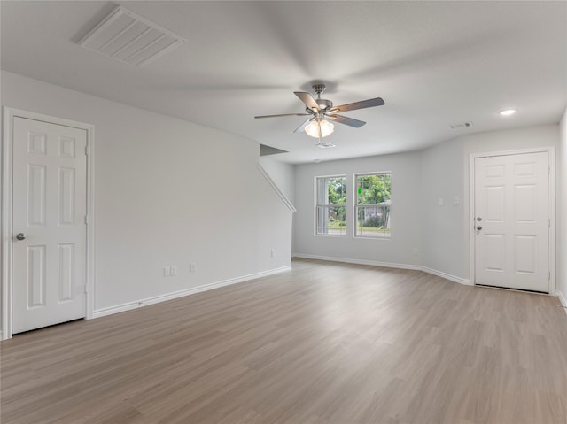 312 N Orange St, Sweeny, TX 77480 - unfurnished living room featuring a ceiling fan, light wood-style floors, and recessed lighting