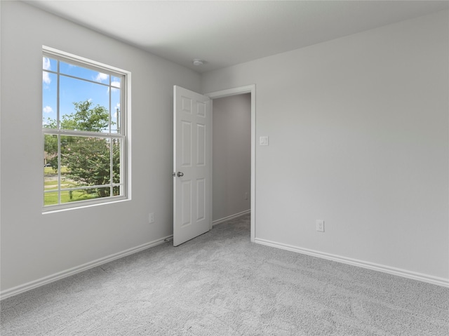 312 N Orange St, Sweeny, TX 77480 - empty room featuring healthy amount of natural light and carpet