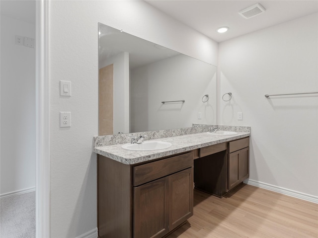 312 N Orange St, Sweeny, TX 77480 - bathroom with double vanity and wood finished floors