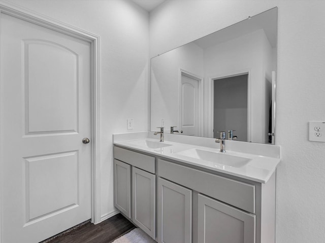 17831 Sommerset Falls Ln, Crosby, TX 77532 - full bathroom with double vanity and wood finished floors