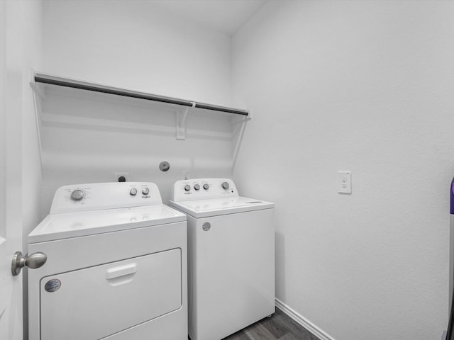 17831 Sommerset Falls Ln, Crosby, TX 77532 - washroom with washing machine and clothes dryer and dark wood-style flooring