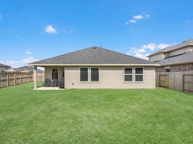 17831 Sommerset Falls Ln, Crosby, TX 77532 - back of house with a fenced backyard, a patio area, and a shingled roof