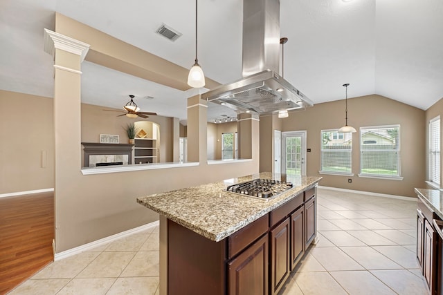15015 Cozy Hollow Ln, Houston, TX 77044 - kitchen with island exhaust hood, ceiling fan, stainless steel gas stovetop, plenty of natural light, and lofted ceiling