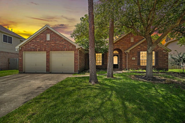 15015 Cozy Hollow Ln, Houston, TX 77044 - view of front of house featuring driveway, a front yard, and brick siding