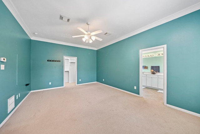 15015 Cozy Hollow Ln, Houston, TX 77044 - unfurnished bedroom with crown molding, carpet, a walk in closet, connected bathroom, and ceiling fan