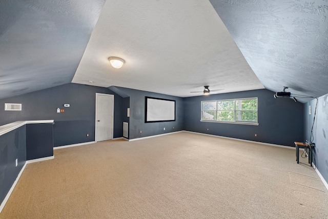 15015 Cozy Hollow Ln, Houston, TX 77044 - bonus room featuring lofted ceiling, a textured ceiling, light carpet, and ceiling fan