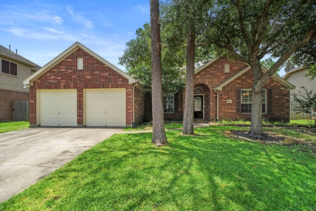 15015 Cozy Hollow Ln, Houston, TX 77044 - view of front of home featuring driveway, a front yard, brick siding, and a garage