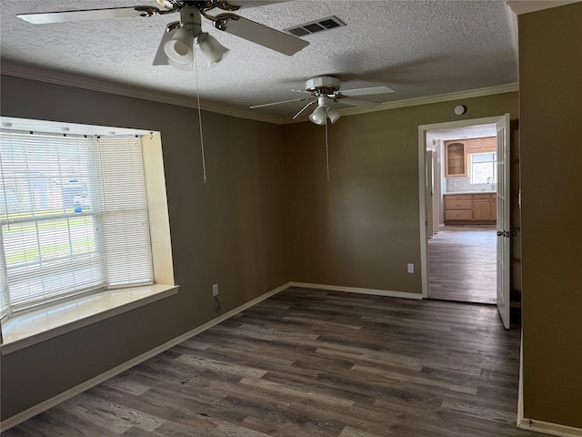 4706 Owens Creek Ln, Spring, TX 77388 - empty room featuring a textured ceiling, plenty of natural light, ornamental molding, ceiling fan, and dark wood-style flooring