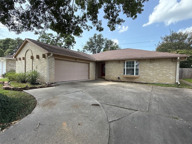 4706 Owens Creek Ln, Spring, TX 77388 - single story home with concrete driveway, brick siding, and a garage