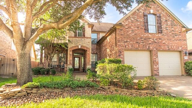 14402 Hazeldale Dr, Cypress, TX 77429 - view of front of property with brick siding, concrete driveway, and a garage