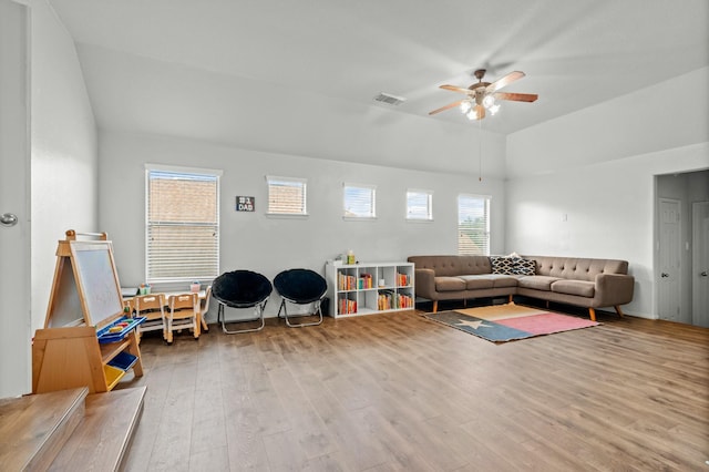 14402 Hazeldale Dr, Cypress, TX 77429 - living room featuring lofted ceiling, wood finished floors, and ceiling fan