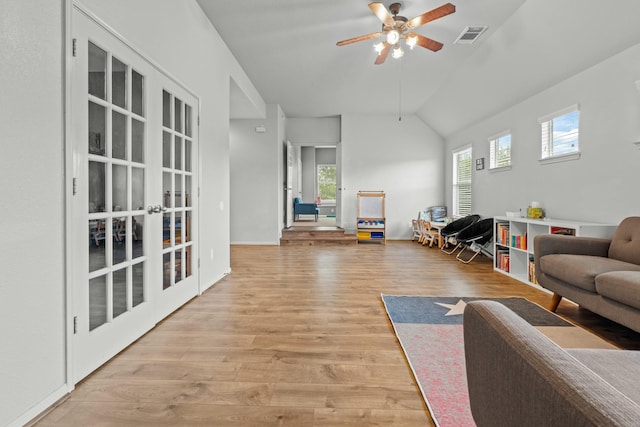 14402 Hazeldale Dr, Cypress, TX 77429 - living area with french doors, ceiling fan, light wood finished floors, and lofted ceiling