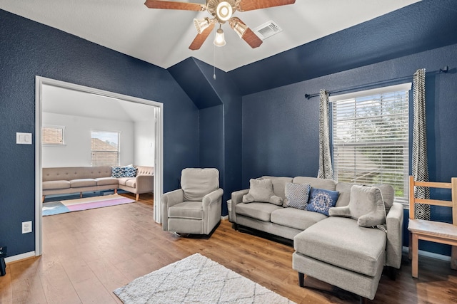 14402 Hazeldale Dr, Cypress, TX 77429 - living room with a textured wall, ceiling fan, wood finished floors, and vaulted ceiling