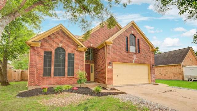 107 Mango St, Lake Jackson, TX 77566 - traditional home with brick siding, driveway, and an attached garage