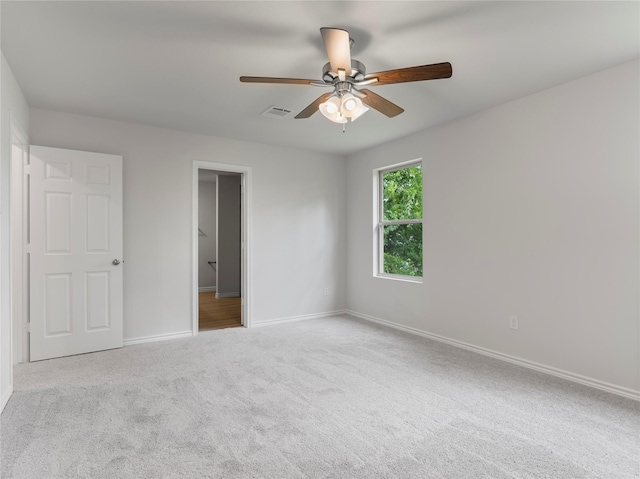306 N Orange St, Sweeny, TX 77480 - unfurnished bedroom featuring carpet flooring and a ceiling fan