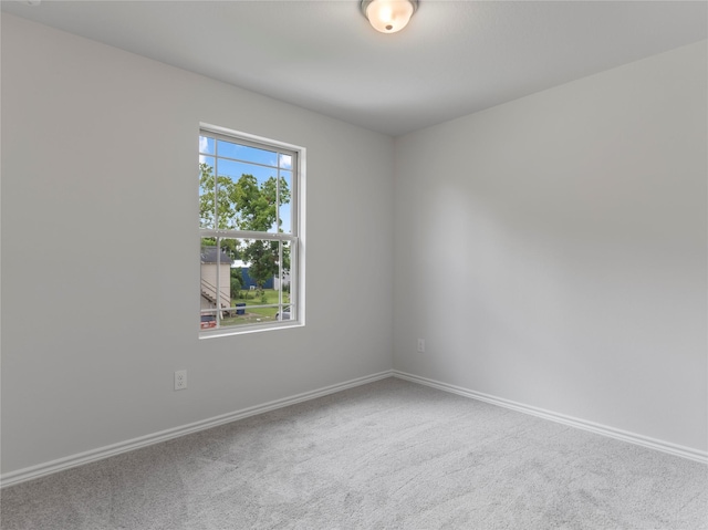 306 N Orange St, Sweeny, TX 77480 - spare room with baseboards and carpet flooring