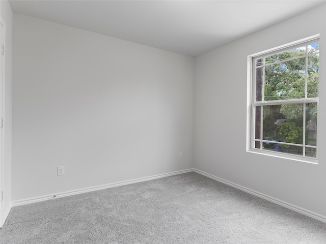 306 N Orange St, Sweeny, TX 77480 - carpeted empty room featuring baseboards