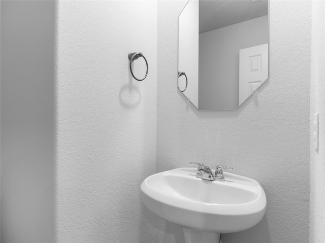 306 N Orange St, Sweeny, TX 77480 - bathroom with a sink and a textured wall