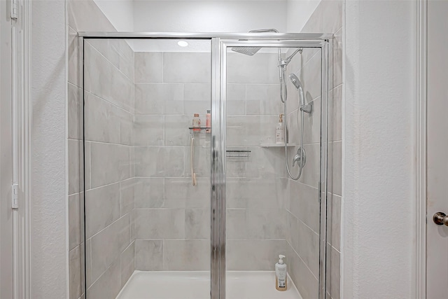 5703 Morning Vista Rd, Katy, TX 77493 - bathroom featuring a stall shower and a textured wall
