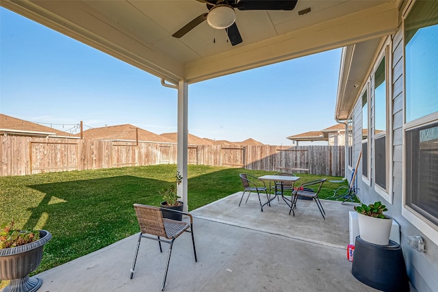 5703 Morning Vista Rd, Katy, TX 77493 - fenced backyard featuring ceiling fan, outdoor dining space, and a patio