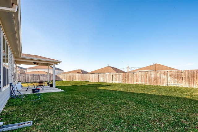 5703 Morning Vista Rd, Katy, TX 77493 - fenced backyard featuring a patio and a ceiling fan