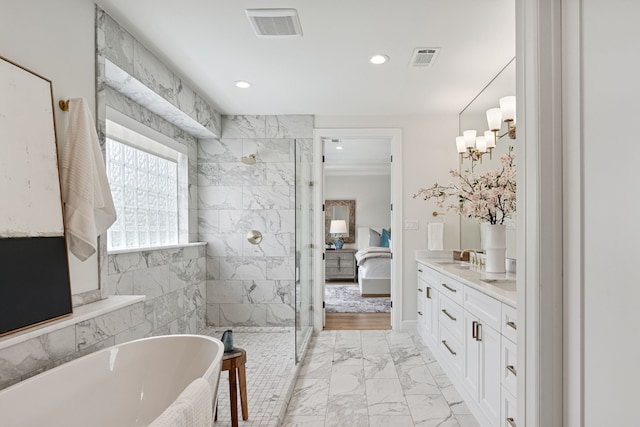 919 Worthshire St, Houston, TX 77008 - ensuite bathroom with a soaking tub, marble finish floors, a marble finish shower, double vanity, and recessed lighting