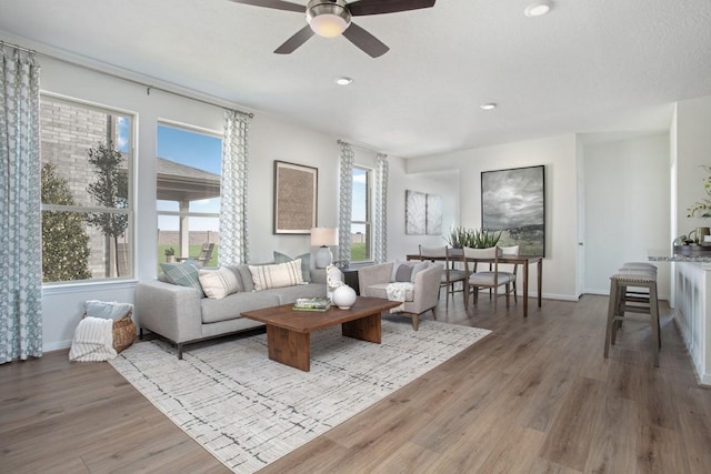21115 Montego Bay Dr, Cypress, TX 77433 - living area featuring wood finished floors, a ceiling fan, and recessed lighting