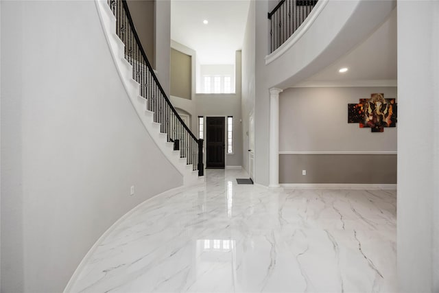 4306 Dalea Clover Ln, Manvel, TX 77578 - foyer with marble tiled flooring, a high ceiling, stairs, and recessed lighting