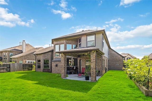 4306 Dalea Clover Ln, Manvel, TX 77578 - rear view of property featuring brick siding and a patio area