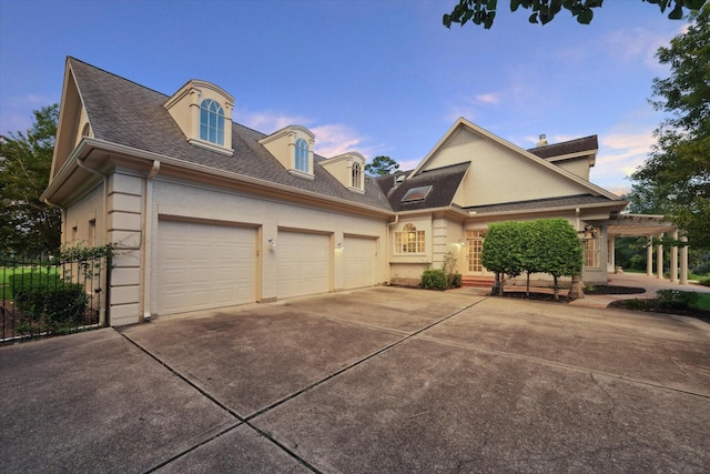 106 Melody Ln, Friendswood, TX 77546 - view of front of property with driveway, a shingled roof, and an attached garage