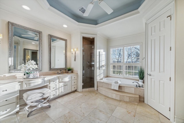 106 Melody Ln, Friendswood, TX 77546 - bathroom with a ceiling fan, vanity, a garden tub, a stall shower, and ornamental molding