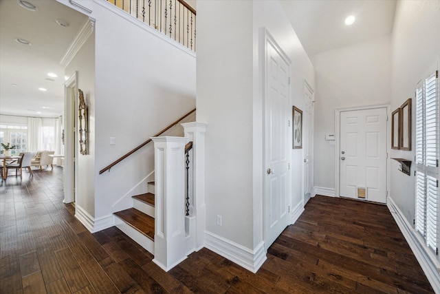 106 Melody Ln, Friendswood, TX 77546 - entryway featuring wood-type flooring, a high ceiling, stairway, and recessed lighting