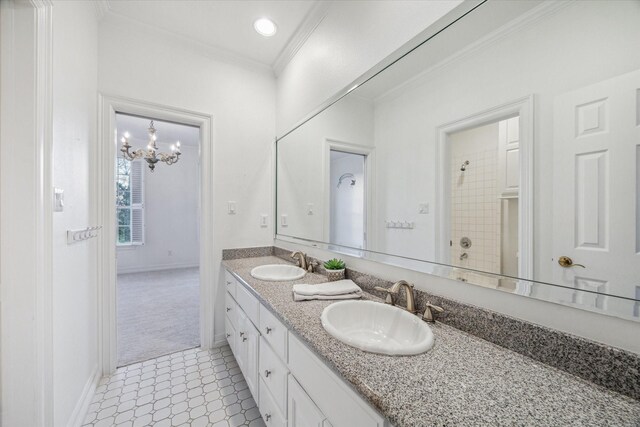106 Melody Ln, Friendswood, TX 77546 - bathroom featuring double vanity, a chandelier, crown molding, and tile patterned floors