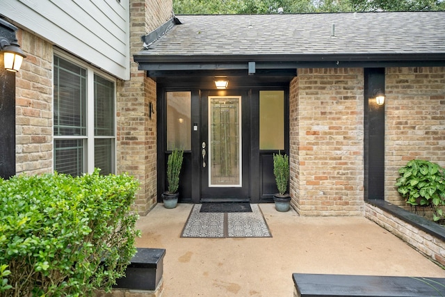 4018 Shady Springs Dr, Seabrook, TX 77586 - doorway to property with a shingled roof and brick siding