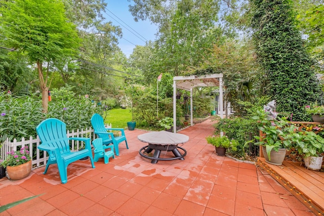 4018 Shady Springs Dr, Seabrook, TX 77586 - view of patio featuring a fire pit