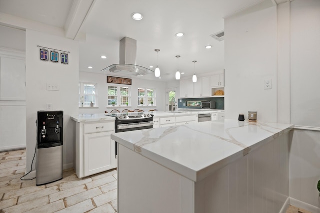 4018 Shady Springs Dr, Seabrook, TX 77586 - kitchen featuring a peninsula, island exhaust hood, recessed lighting, white cabinetry, and stainless steel appliances