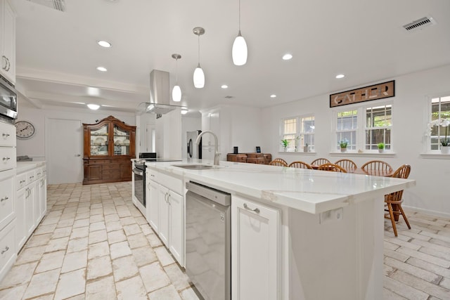4018 Shady Springs Dr, Seabrook, TX 77586 - kitchen with stainless steel appliances, island range hood, white cabinetry, a center island with sink, and recessed lighting