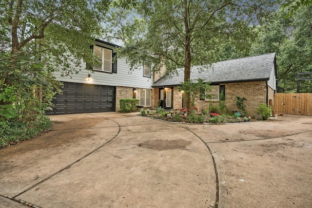 4018 Shady Springs Dr, Seabrook, TX 77586 - traditional home featuring brick siding, driveway, an attached garage, and roof with shingles
