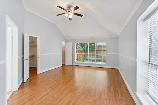 4311 Pebble Beach Dr, League City, TX 77573 - unfurnished bedroom featuring light wood-style floors, vaulted ceiling, ornamental molding, a walk in closet, and ceiling fan