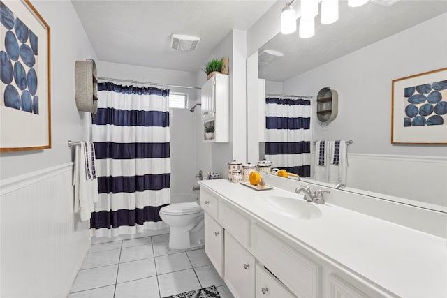 4311 Pebble Beach Dr, League City, TX 77573 - full bathroom featuring vanity, wainscoting, and tile patterned flooring