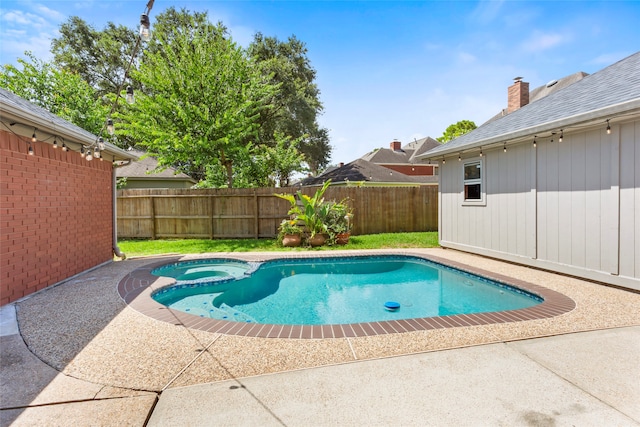 4311 Pebble Beach Dr, League City, TX 77573 - view of swimming pool featuring a pool with connected hot tub, a fenced backyard, and a patio