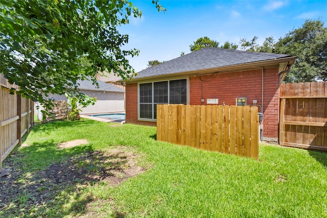 4311 Pebble Beach Dr, League City, TX 77573 - rear view of property with brick siding, roof with shingles, and a fenced backyard