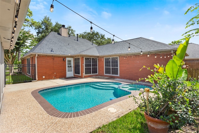 4311 Pebble Beach Dr, League City, TX 77573 - view of swimming pool featuring a pool with connected hot tub and a patio area