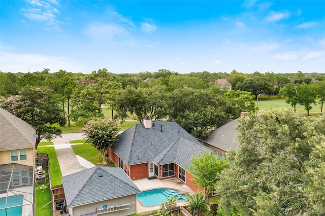 4311 Pebble Beach Dr, League City, TX 77573 - view from above of property with a tree filled landscape and a pool