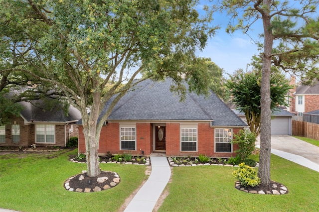 4311 Pebble Beach Dr, League City, TX 77573 - view of front facade featuring brick siding, a shingled roof, and an outdoor structure